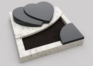 Herzförmiger Grabstein AU131 mit Liegestein aus Giallo Brazil – Indian black, weiß gesprenkelter Naturstein und dunkle Einfassung mit klaren Kanten.